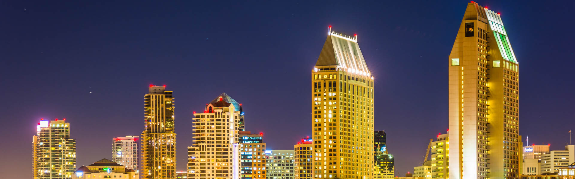 Neon color image of a band playing and people singing along